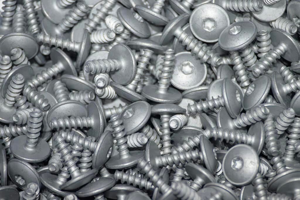 Protective coating layers used on custom deck screws for exterior durability