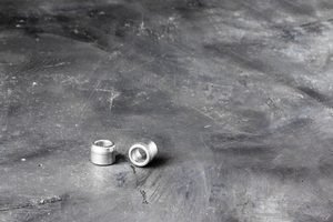 Self-clinching nut for sheet-metal electronics enclosures