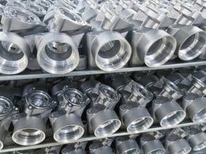 Thread forming screws for die cast aluminum: machined housings on a rack