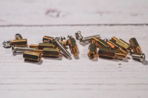 Brass hex standoffs and stainless screws for PCB mounting